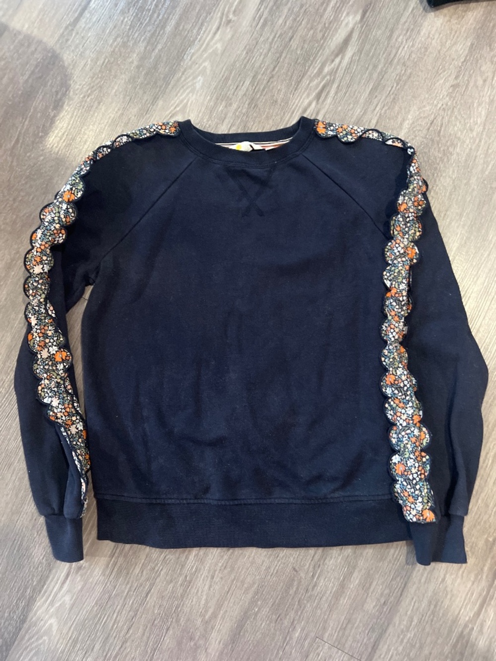 Boden navy blue sweatshirt with floral fabric ruffle along sleeves (size 4)